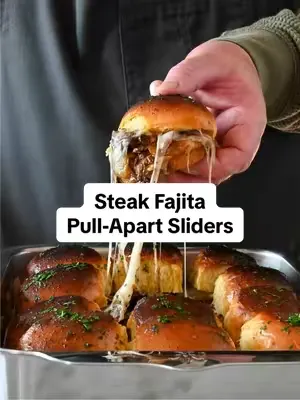 Steak fajitas 🤝 pull-apart sliders = the crowd favorite every single time 🌮🔥 Loaded with seared steak, peppers, onions, melty cheese, and packed onto buttery slider buns, these are dangerously easy to