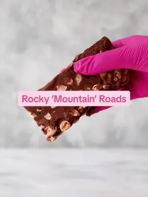 Milk chocolate, crunchy digestives & gooey pink + white marshmallows = our Rocky Mountain Road 😍🍫🍡 What’s in here? All the best bits for maximum crumble & chew!  #RockyRoadLove #SweetStack #ChocolateC
