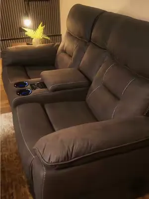 Built For The Ultimate Experience. A hi-tech recliner sofa with massage, cooling cup holders, wireless charging and USB — designed for modern home cinema living. #reclinersofa #cinemasofa #smartsofa #