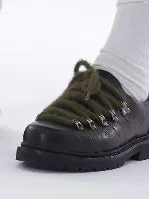 Alpine elements recontextualized. Breaking the traditional derby silhouette with industrial D-rings and aggressive croc-embossed tension. Utilitarian hardware anchored in vanguard tailoring. #cricleca